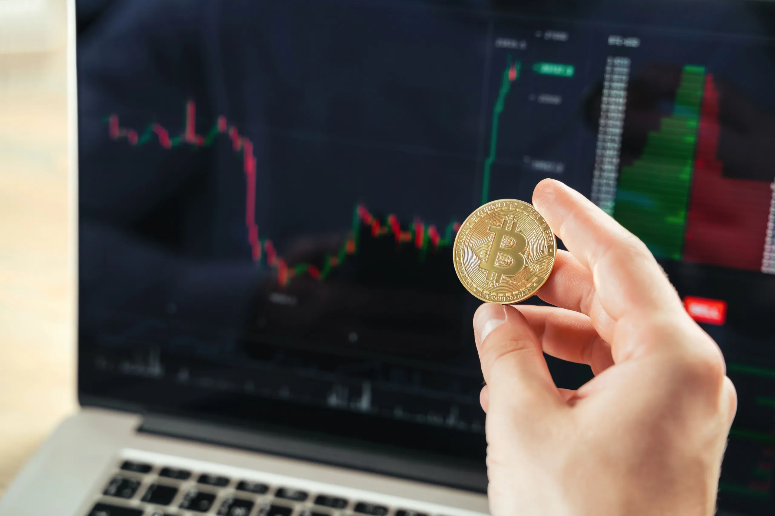 crypto trader hands with golden bitcoin